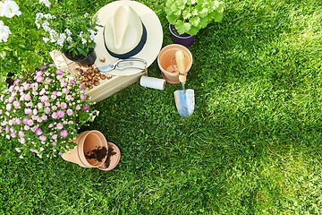 Image showing garden tools, wooden box and flowers at summer