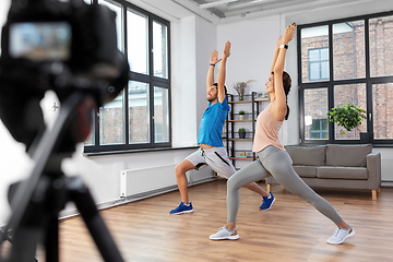 Image showing couple recording home yoga class video