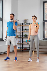 Image showing happy couple exercising at home
