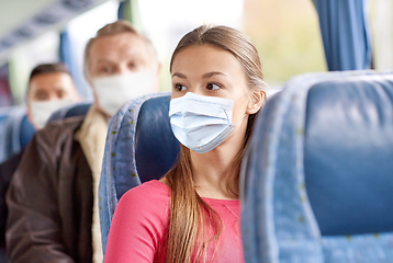 Image showing young woman in mask sitting in travel bus or train