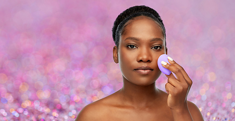 Image showing african american woman with make up sponge