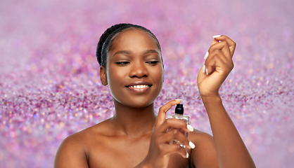 Image showing young african american woman with perfume