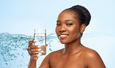 Image showing young african american woman with glass of water