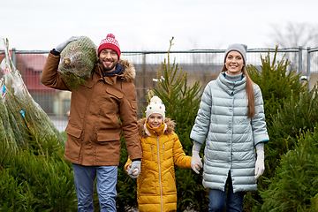 Image showing happy family buying christmas tree at market