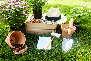 Image showing garden tools, wooden box and flowers at summer