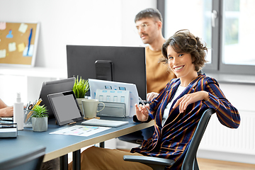 Image showing smiling businesswoman at office conference