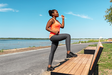 Image showing african american woman doing sports at seaside