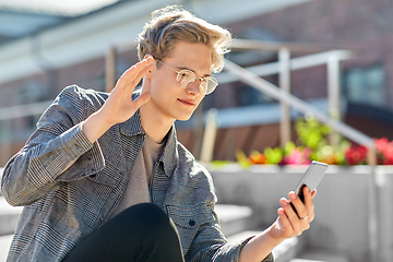 Image showing teenage boy with smartphone having video call