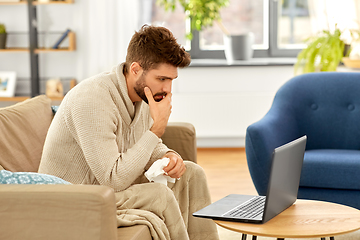 Image showing sick man having video call on laptop at home