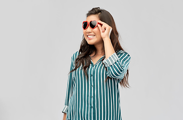 Image showing happy asian woman with in heart shaped sunglasses