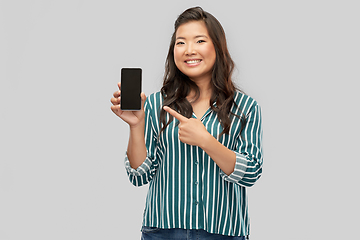 Image showing happy asian woman over grey background