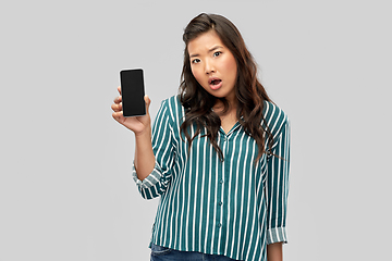 Image showing shocked asian woman over grey background