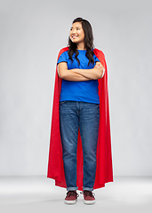 Image showing happy asian woman in red superhero cape