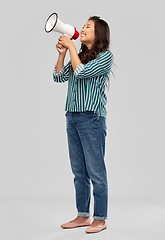 Image showing happy smiling asian woman speaking to megaphone