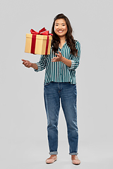 Image showing happy asian woman with birthday present