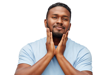 Image showing happy african american man touching his beard