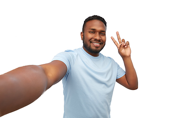 Image showing smiling african american man taking selfie