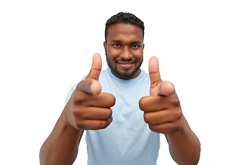 Image showing smiling african american man pointing to camera