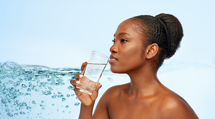 Image showing young african american woman with glass of water