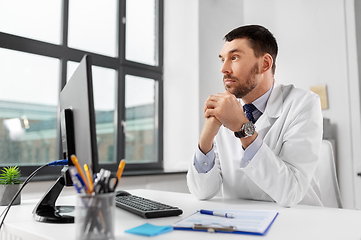 Image showing male doctor with computer working at hospital