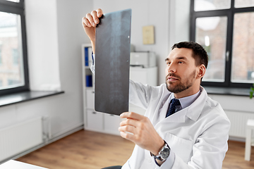 Image showing male doctor with x-ray of spine at hospital