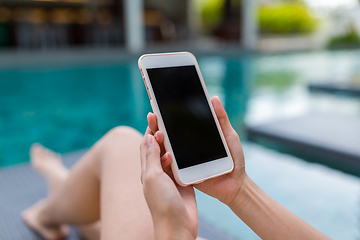 Image showing Woman use of cellphone in swimming pool