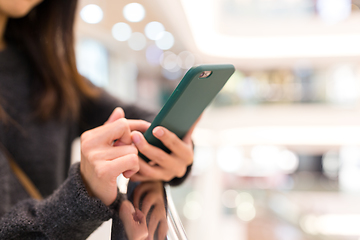 Image showing Woman use of mobile phone in shopping mall