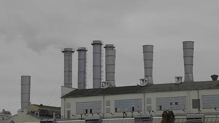 Image showing Pipes with smoke in a factory building