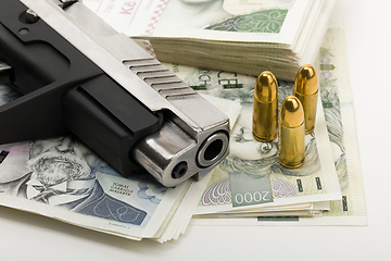 Image showing gun and czech banknotes, crime concept