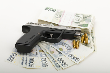 Image showing gun and czech banknotes, crime concept