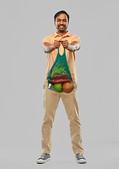 Image showing happy indian man with food in reusable net tote