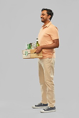 Image showing smiling young indian man sorting glass waste