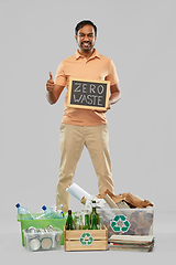 Image showing smiling man sorting paper, glass and plastic waste