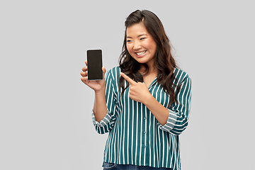 Image showing happy asian woman over grey background