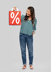 Image showing asian woman with percentage sign on shopping bags