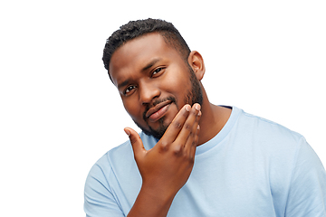 Image showing happy african american man touching his beard