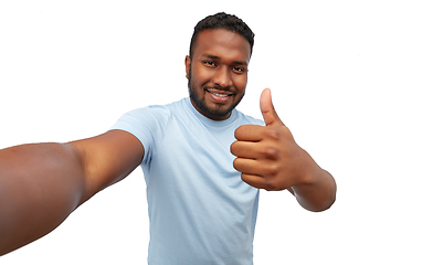 Image showing smiling young african american man taking selfie