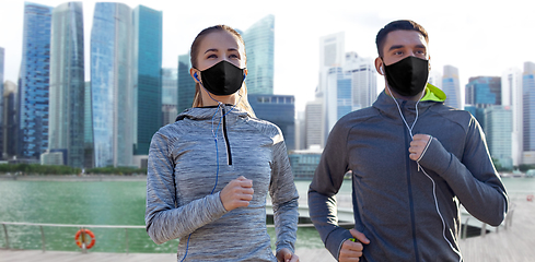 Image showing couple in masks jogging in singapore