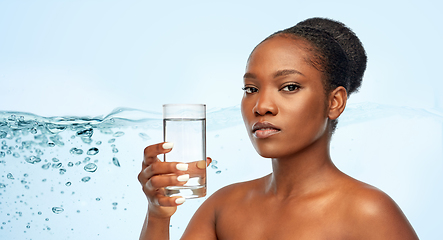 Image showing young african american woman with glass of water