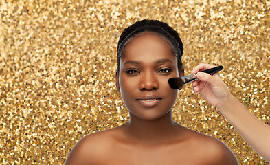 Image showing african woman and hand with make up brush