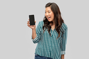 Image showing happy asian woman over grey background