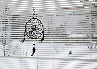 Image showing dream catcher on bedroom window and open blinds
