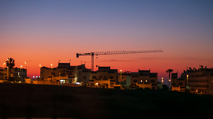 Image showing daybreak sunrise crane