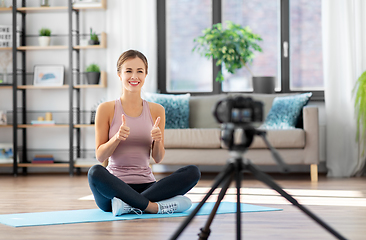 Image showing woman or blogger recording training class at home