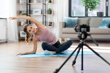 Image showing woman or sports blogger streaming online yoga