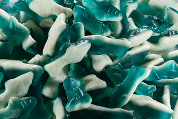 Image showing Green and White Gummy Candy Fish Background