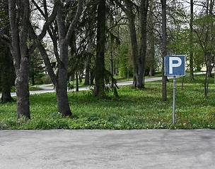 Image showing empty parking and parking sign, deadpan photography
