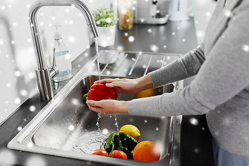 Image showing woman washing fruits and vegetables in kitchen