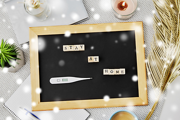 Image showing chalkboard with stay at home words on toy blocks