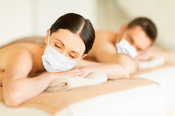 Image showing couple in masks at spa